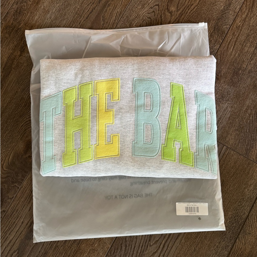 The Bar size large citrus varsity sweatshirt